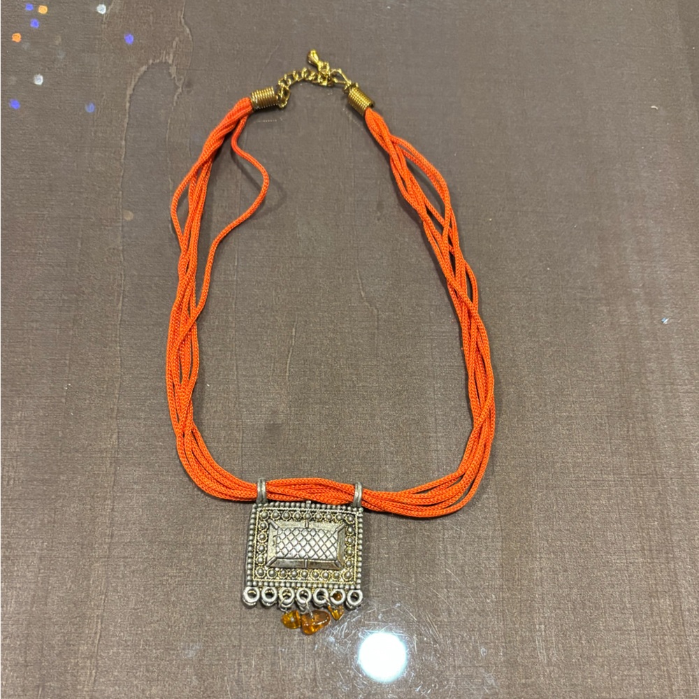 Orange Beaded Necklace with Silver Pendant